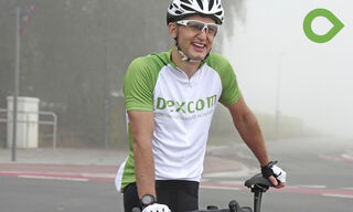 David smiling leaning on bicycle